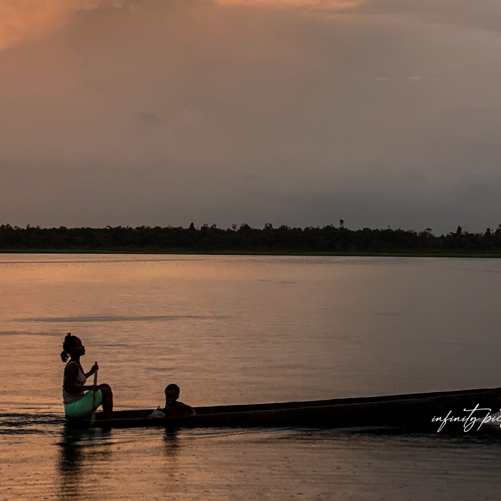 Mother and Child riding a Boat.